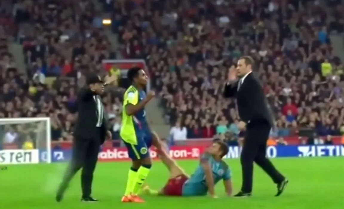 Unexpected Fall at Football Match: Shocking Moment Caught on Camera