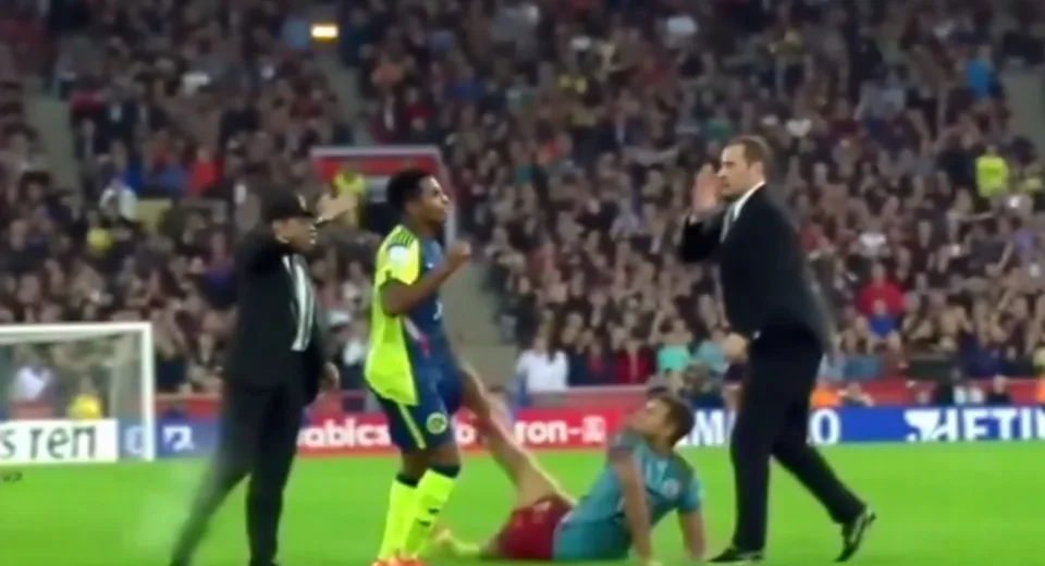 Unexpected Fall at Football Match: Shocking Moment Caught on Camera